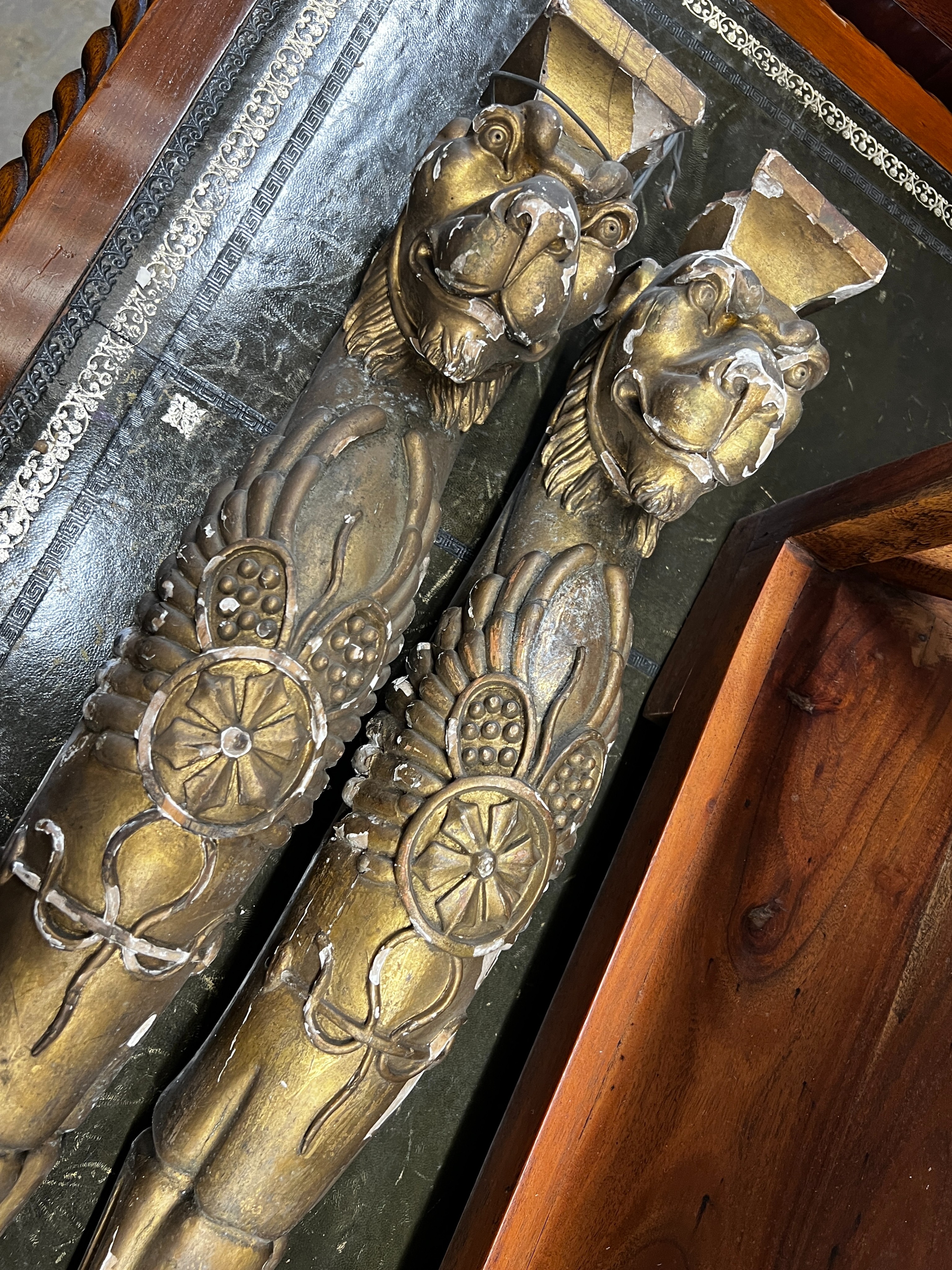 In the manner of Thomas Hope, a pair of 19th century carved giltwood and composition monopodia, height 85cm